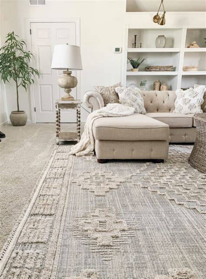 How do you dress a room with a rug?
