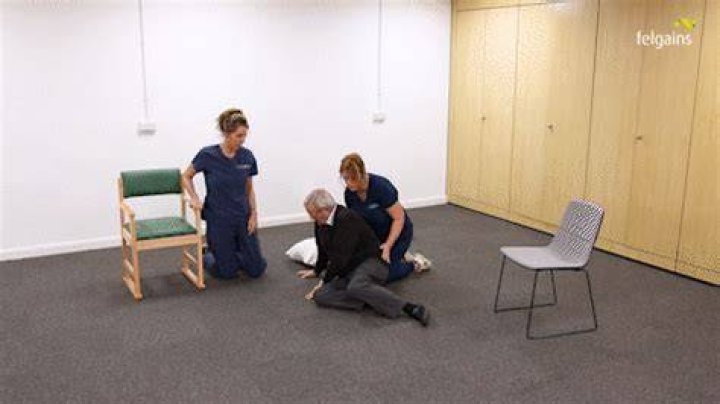 How do you help a heavy person off the floor?