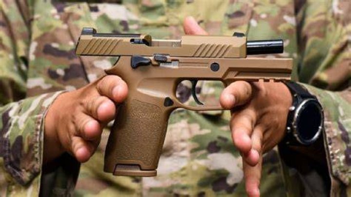 What pistol won the military contract?