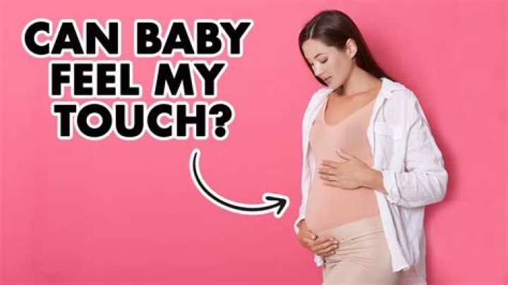 When can my baby feel me rub my belly?