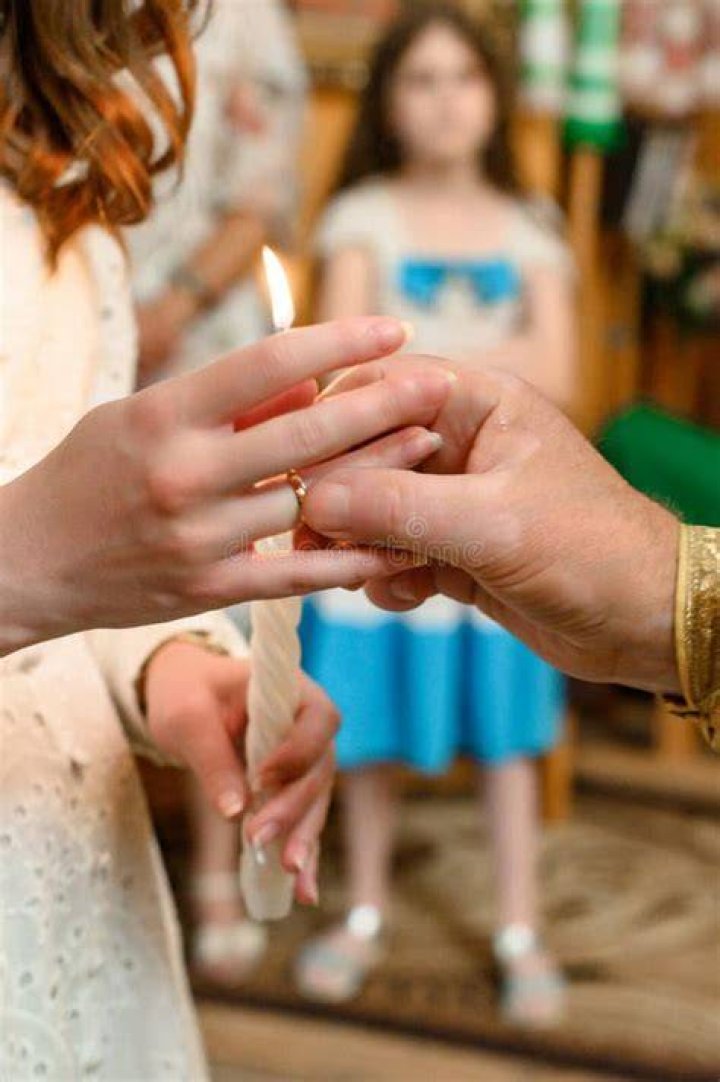 Why do priests wear a ring on their left hand?