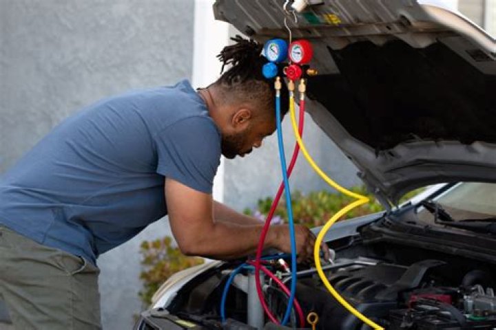 Why is my car AC blowing warm air?